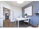 Dining room with views of modern table, chairs, decorative shiplap wall and french doors at 8436 Paxton Dr, Brownsburg, IN 46112