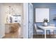 Dining room area with views of modern kitchen and dining space with French doors at 8436 Paxton Dr, Brownsburg, IN 46112