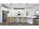 Modern kitchen featuring white cabinetry, stainless steel appliances, and a large center island at 8436 Paxton Dr, Brownsburg, IN 46112