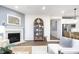 Living room features a fireplace and view to kitchen with stainless appliances at 8436 Paxton Dr, Brownsburg, IN 46112