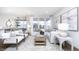 Bright living room featuring white furniture, area rug and view to dining area at 8436 Paxton Dr, Brownsburg, IN 46112