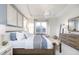 Bright main bedroom featuring tray ceilings, a seating area, and large windows providing plenty of natural light at 8436 Paxton Dr, Brownsburg, IN 46112