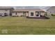 Backyard with patio, generous lawn space, and play area for outdoor fun at 845 Blackberry Dr, Greenwood, IN 46143