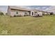 Spacious backyard with patio, lush lawn, and a well-kept home exterior at 845 Blackberry Dr, Greenwood, IN 46143