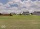 View of a large backyard in a suburban neighborhood with mature trees at 845 Blackberry Dr, Greenwood, IN 46143