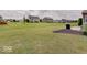 Large, grassy backyard featuring a patio and mature landscaping perfect for relaxation at 845 Blackberry Dr, Greenwood, IN 46143