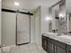 The bathroom boasts dual vessel sinks, a sliding barn door, and modern lighting fixtures at 845 Blackberry Dr, Greenwood, IN 46143