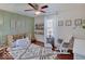 A Bedroom is shown with green paneled walls and luxury flooring at 845 Blackberry Dr, Greenwood, IN 46143