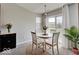 Bright dining area featuring a round table, chairs, and a sliding glass door with access to the outdoors at 845 Blackberry Dr, Greenwood, IN 46143