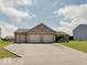 Lovely single-story home featuring a three-car garage, basketball hoop, and paved driveway at 845 Blackberry Dr, Greenwood, IN 46143