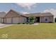 Charming single-story home boasts a well-manicured lawn, two-car garage, and inviting curb appeal at 845 Blackberry Dr, Greenwood, IN 46143
