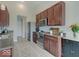 Well-equipped kitchen with stainless steel appliances, dark cabinetry and ample counter space at 845 Blackberry Dr, Greenwood, IN 46143