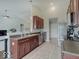 Modern kitchen with stainless steel appliances, dark cabinets, and an island with a sink at 845 Blackberry Dr, Greenwood, IN 46143