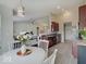 Modern kitchen and dining area boasting stainless steel appliances and hardwood floors at 845 Blackberry Dr, Greenwood, IN 46143