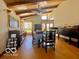 Open-concept dining room with hardwood floors and lots of natural light at 8604 W Tulip Tree Dr, Muncie, IN 47304