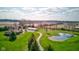 Expansive aerial view showcasing the home, outbuilding, pond, and surrounding landscape at 9377 N 500 W, McCordsville, IN 46055