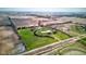 Aerial shot showcasing a rural property with a winding driveway, pond, and open fields at 9377 N 500 W, McCordsville, IN 46055