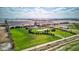 Wide aerial view of a home with manicured lawns, pond, and outbuildings surrounded by farmland at 9377 N 500 W, McCordsville, IN 46055
