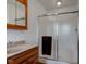 Bathroom featuring a vanity with storage and a shower with glass doors at 9377 N 500 W, McCordsville, IN 46055