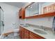 Bathroom features a double sink vanity, wood cabinetry, and a large mirror at 9377 N 500 W, McCordsville, IN 46055