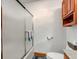 Bathroom features a frosted glass shower, tiled floors, and built in cabinet at 9377 N 500 W, McCordsville, IN 46055