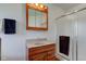 Updated bathroom features a vanity with ample storage and a shower with glass doors at 9377 N 500 W, McCordsville, IN 46055