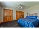 Large bedroom featuring a bed, closet and dresser with dark carpeting at 9377 N 500 W, McCordsville, IN 46055