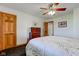 Bright bedroom with wood trim, ceiling fan, carpet, dresser and doorway at 9377 N 500 W, McCordsville, IN 46055