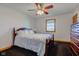 Comfortable bedroom with dark carpet, ceiling fan and a large window at 9377 N 500 W, McCordsville, IN 46055
