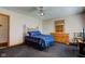 Bedroom featuring a bed, dresser, mirror, ceiling fan, and bedside table at 9377 N 500 W, McCordsville, IN 46055