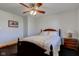 Bedroom with dark carpet, white walls, ceiling fan and a lamp on the nightstand at 9377 N 500 W, McCordsville, IN 46055