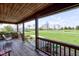 Spacious covered porch features a wooden swing and scenic views of the lush green lawn at 9377 N 500 W, McCordsville, IN 46055