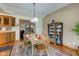 Cozy dining room boasts hardwood floors, wooden table set, and classic built-ins for storage at 9377 N 500 W, McCordsville, IN 46055