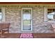 Inviting front entrance with a glass-paneled door, charming shutters, and a warm welcome mat at 9377 N 500 W, McCordsville, IN 46055