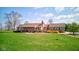 Attractive brick home featuring a well-maintained lawn and classic design elements at 9377 N 500 W, McCordsville, IN 46055