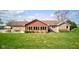 Charming single-story home with brick and wood exterior, complemented by a well-kept lawn and patio at 9377 N 500 W, McCordsville, IN 46055