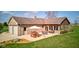 Attractive patio with picnic table and seating area outside the sunroom and garage at 9377 N 500 W, McCordsville, IN 46055