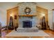 Elegant stone fireplace with a decorative wreath and wooden mantel at 9377 N 500 W, McCordsville, IN 46055