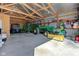 Garage with exposed rafters filled with tractors and other machinery at 9377 N 500 W, McCordsville, IN 46055