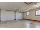 Interior view of the garage, featuring dual garage doors, concrete floors and good lighting at 9377 N 500 W, McCordsville, IN 46055