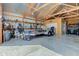Garage with exposed rafters filled with trailers, tractors and other machinery at 9377 N 500 W, McCordsville, IN 46055