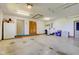 An interior shot of the well lit garage with doors and storage at 9377 N 500 W, McCordsville, IN 46055