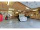 Spacious garage with workbench, covered vehicle, and ample storage, ready for any project at 9377 N 500 W, McCordsville, IN 46055