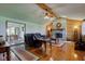 Cozy living room with a stone fireplace, wood paneling, and hardwood floors at 9377 N 500 W, McCordsville, IN 46055