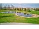 Scenic pond with fountain and rock-lined edge, set within lush green lawn at 9377 N 500 W, McCordsville, IN 46055