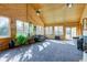 Bright sunroom featuring all-wood construction, plush carpeting, and ample natural light from large windows at 9377 N 500 W, McCordsville, IN 46055