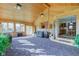 Bright sunroom featuring wood walls, ceilings, plush carpeting and large windows offering natural light at 9377 N 500 W, McCordsville, IN 46055
