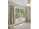 Well-lit bedroom showcasing a window with sheer curtains, neutral wall and floor at 1108 Nanwich Ct, Indianapolis, IN 46217