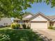 Well-kept single Gathering home with attached garage and manicured lawn at 1108 Nanwich Ct, Indianapolis, IN 46217