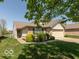 Charming single-story home with a well-maintained lawn and attached garage at 1108 Nanwich Ct, Indianapolis, IN 46217